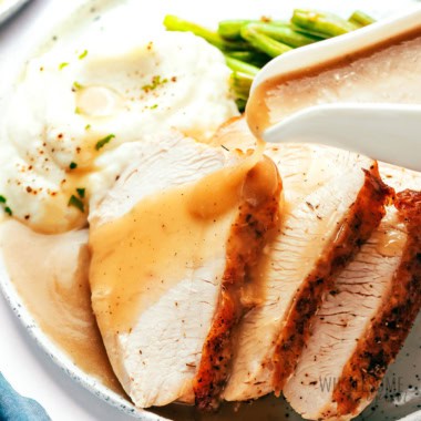 Gluten free gravy poured over turkey.