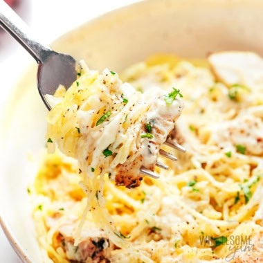 Spaghetti squash Alfredo twirled on a fork.